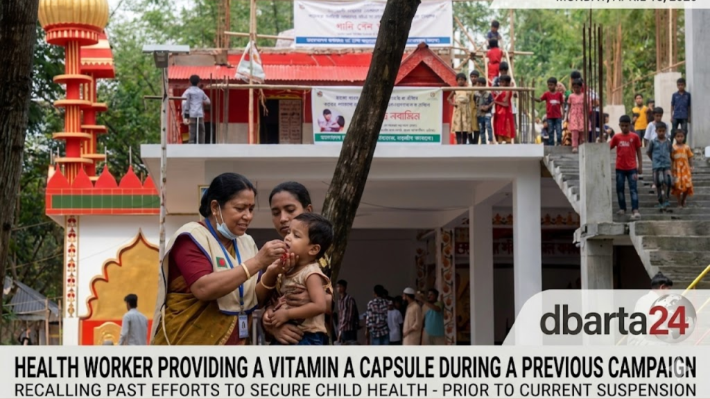 A health worker providing a Vitamin A capsule to a child during a previous national campaign in Bangladesh.
